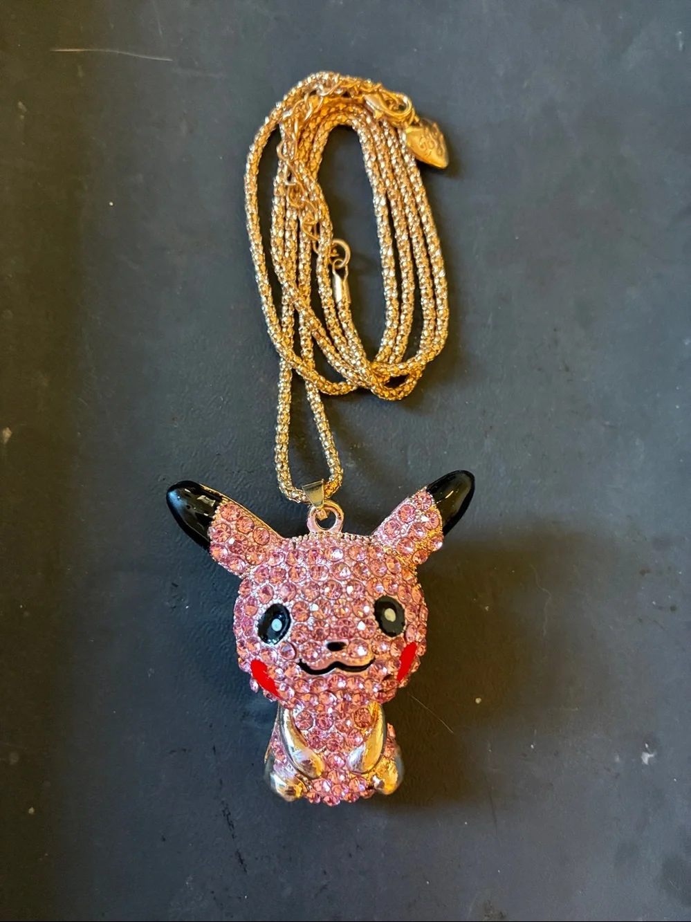 Pikachu Pink Crystal Pendant comes on a golden necklace. NWOT